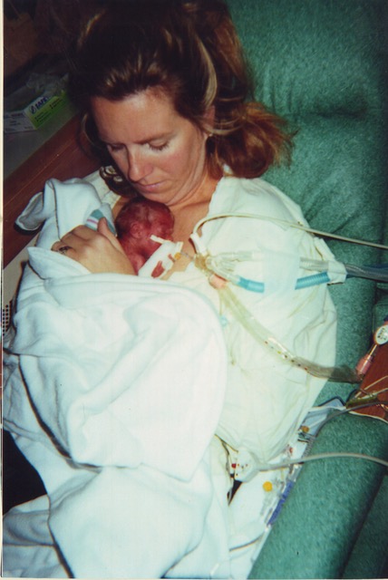 a mother holding a premature baby in honor of world prematurity day