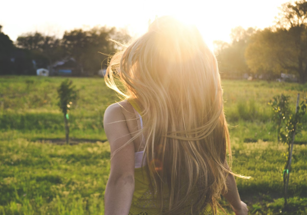 a woman who has stopped trying and is leaning into the energy of already is